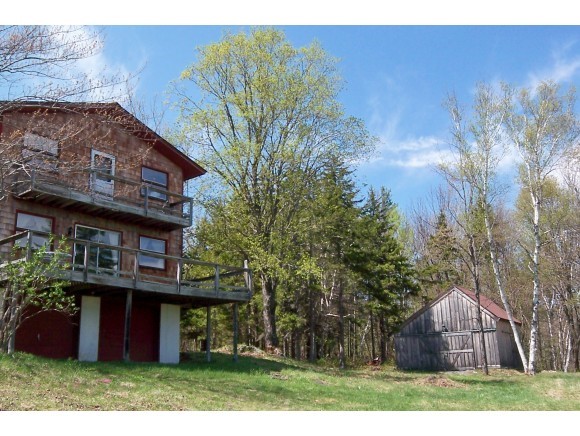 This modest chalet style home with separate barn...