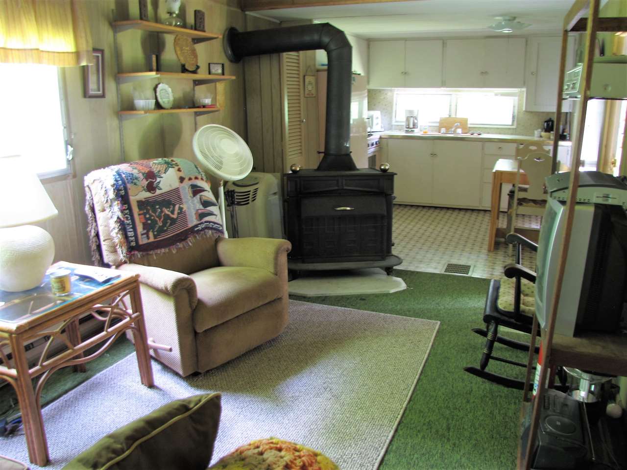 This mobile home sits on 1.2 lovely, level acres,...