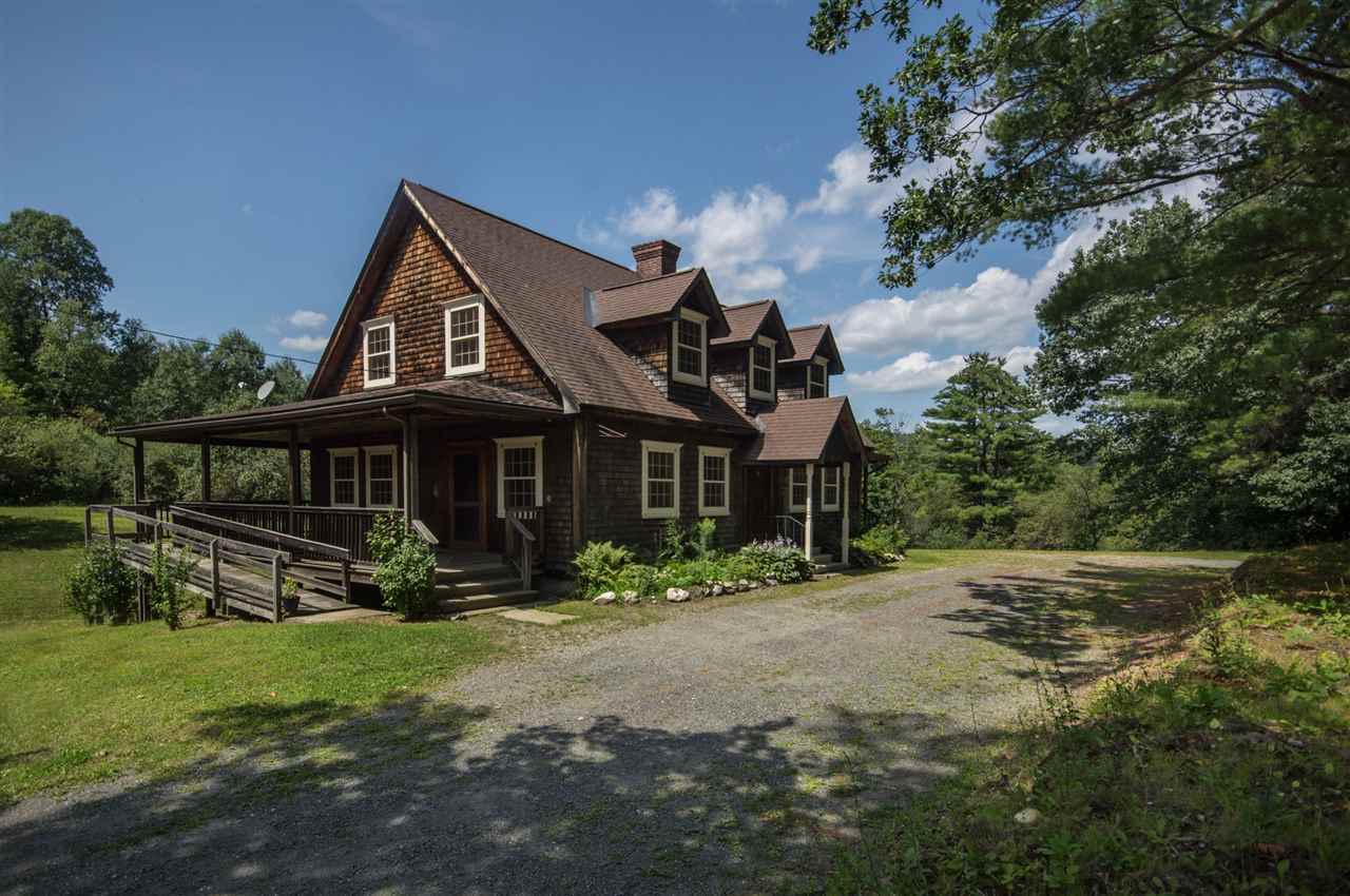 This handsome New England Cape style home with...