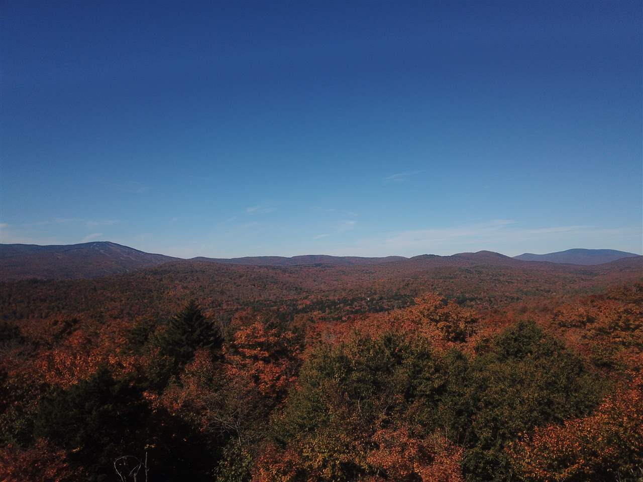 11+ acres of rolling land with dramatic long...
