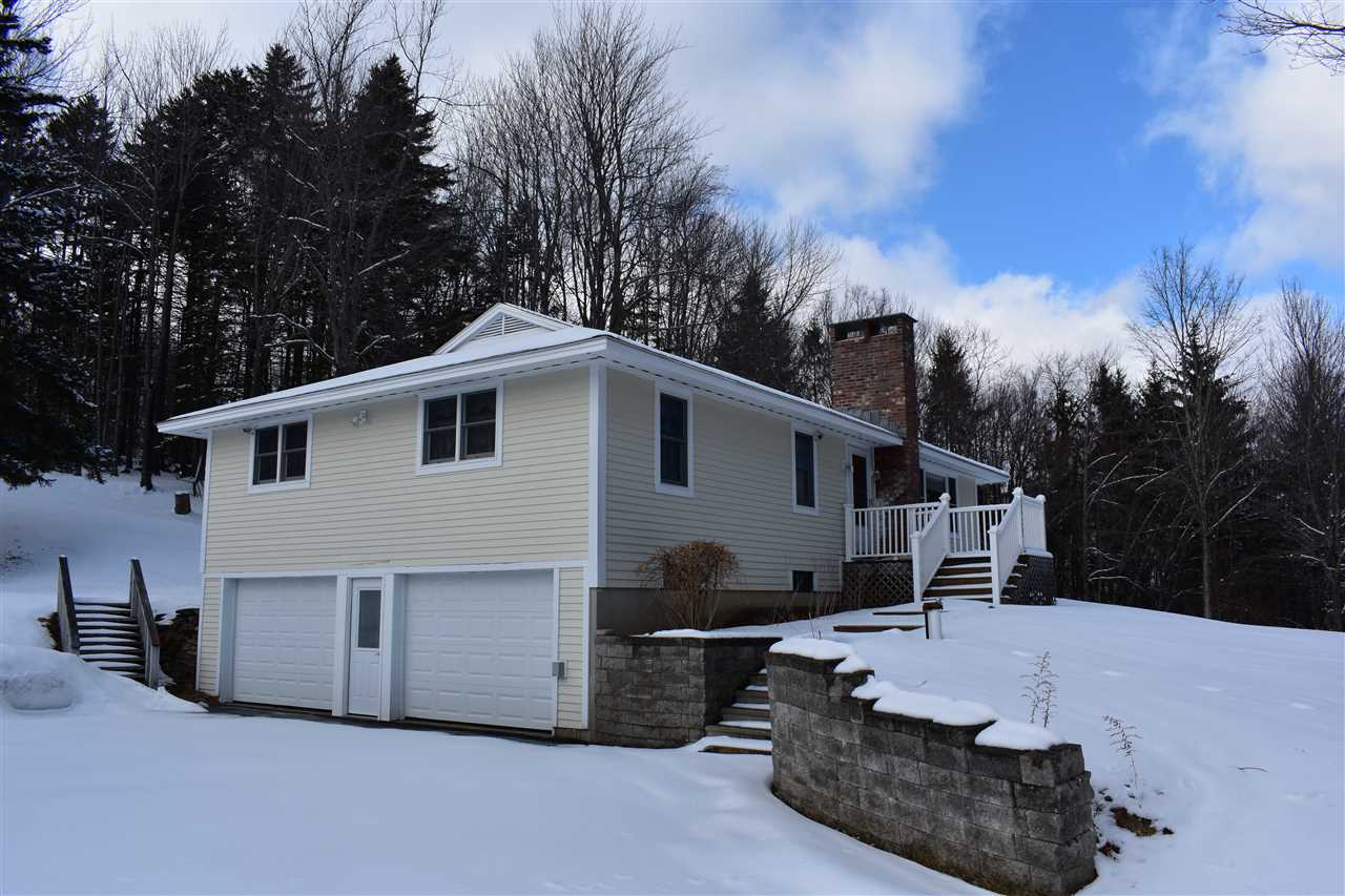 With a lovely setting accented by mature maples,...
