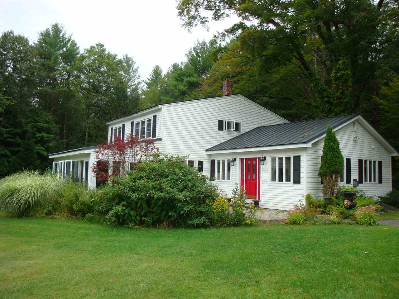 This delightful Vermont farmhouse is surrounded...