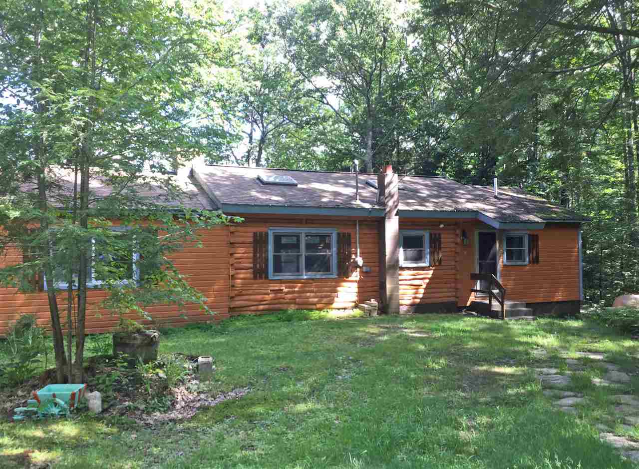 This privately sited cottage sits back from the...