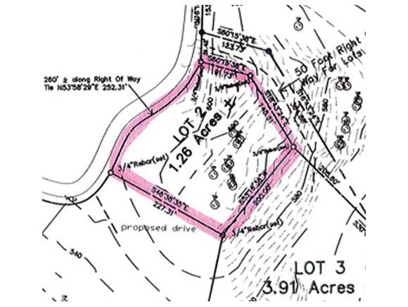 Here's an excellent permitted building lot...