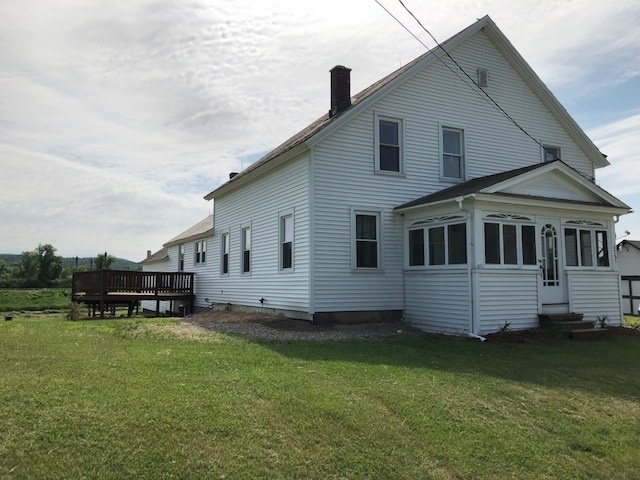 This sweet farmhouse is loaded with character and...