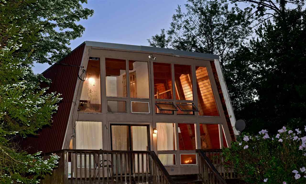 Dramatic use of glass and wood. This residence is...