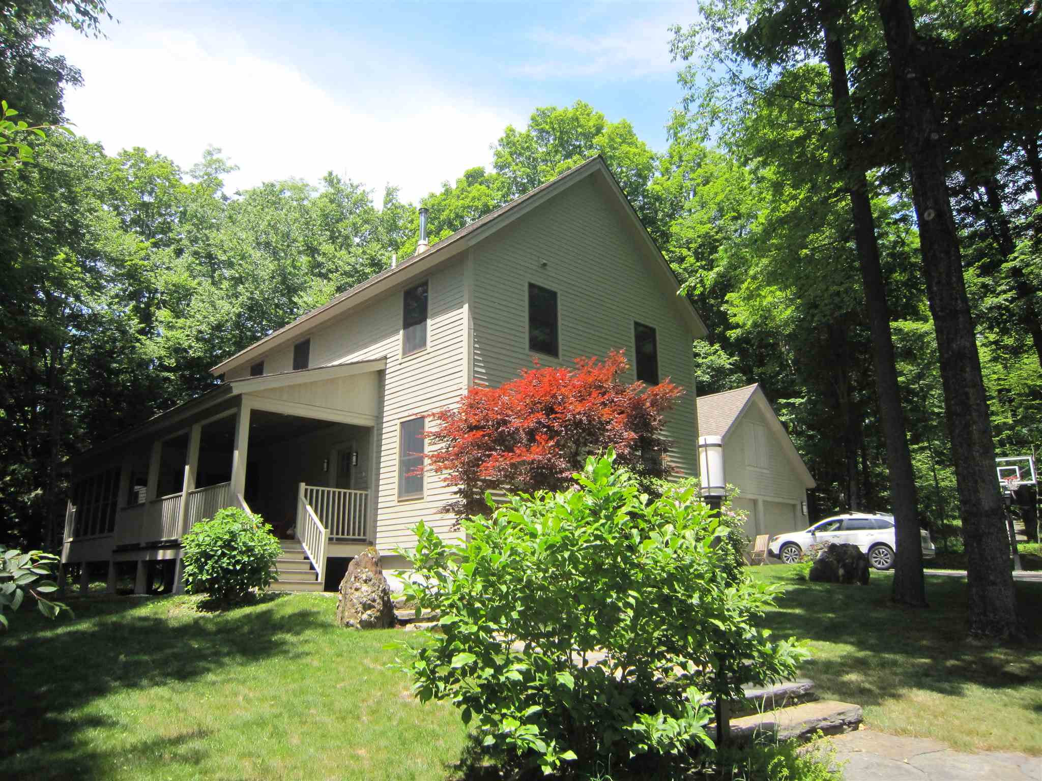 Step up to this award-winning post-and-beam home,...
