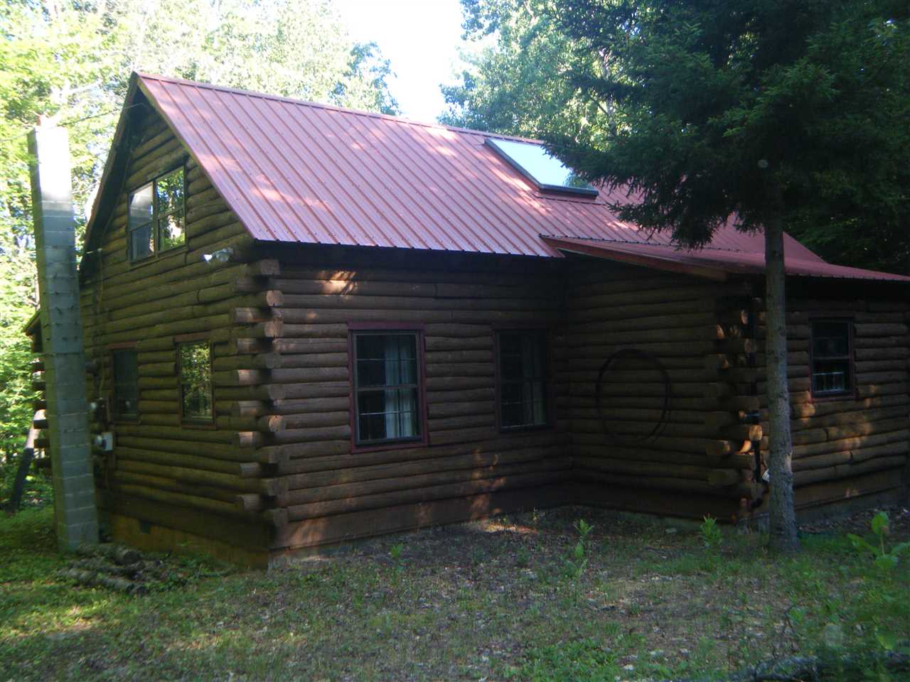 This rustic Log Cabin sits nestled among stately...