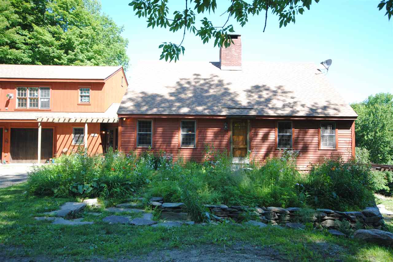 Wonderful country property on 5 acres with apple...
