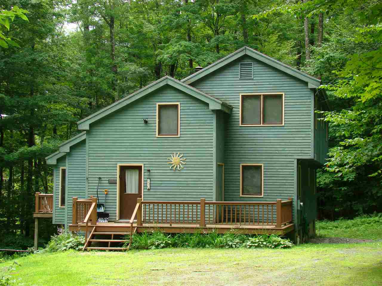 This 5 bedroom/3 bath home sits on a wooded 1...