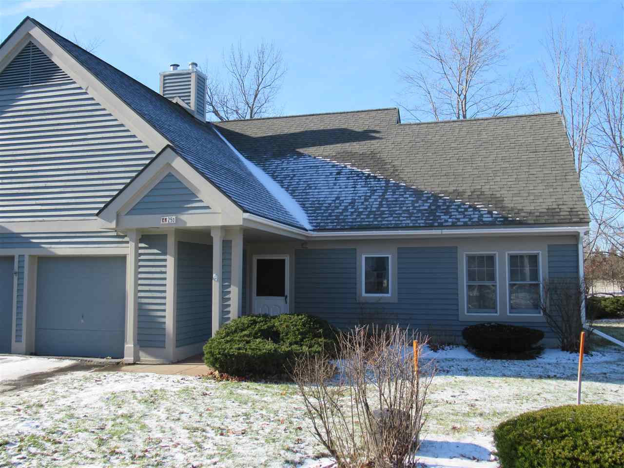 Spacious end unit with one-car attached garage in...