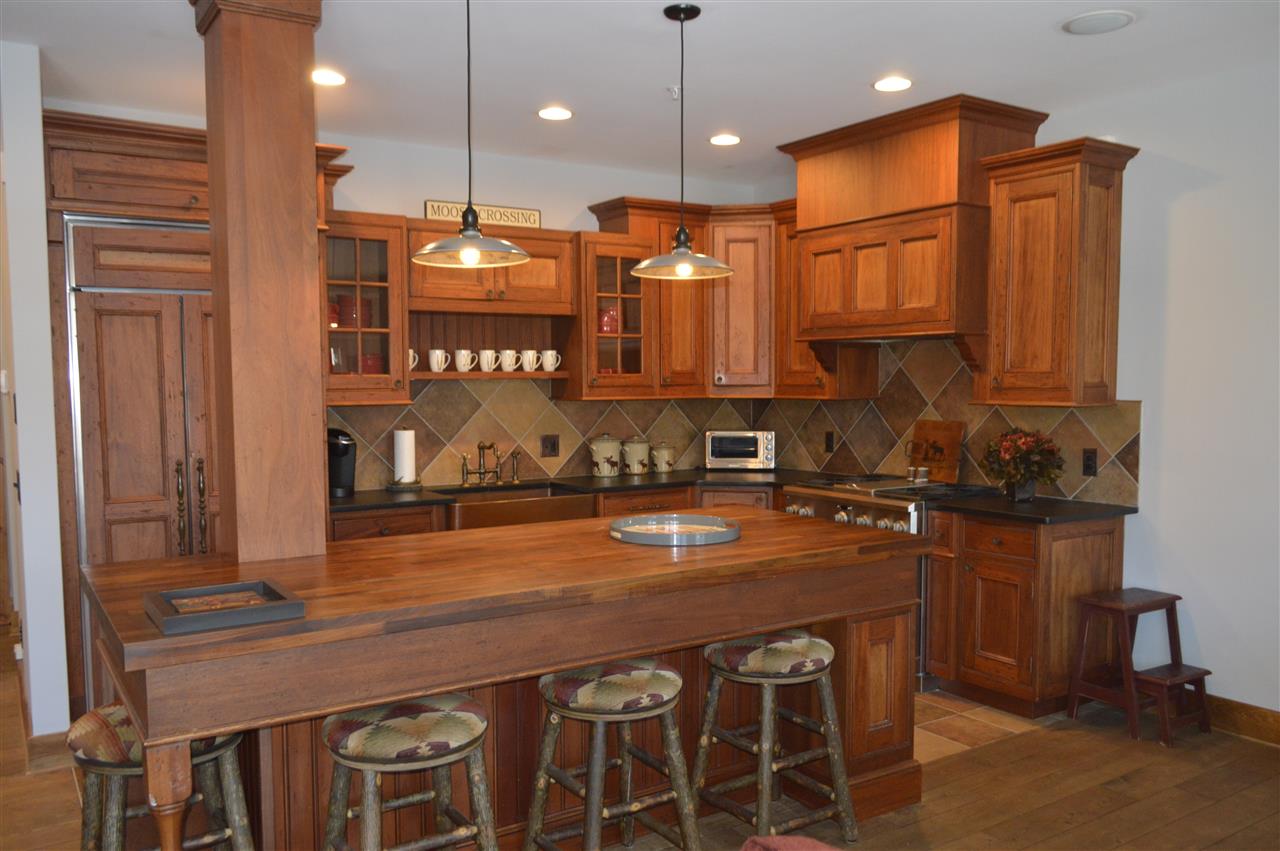 Luxury abounds this magnificent Adirondack style...