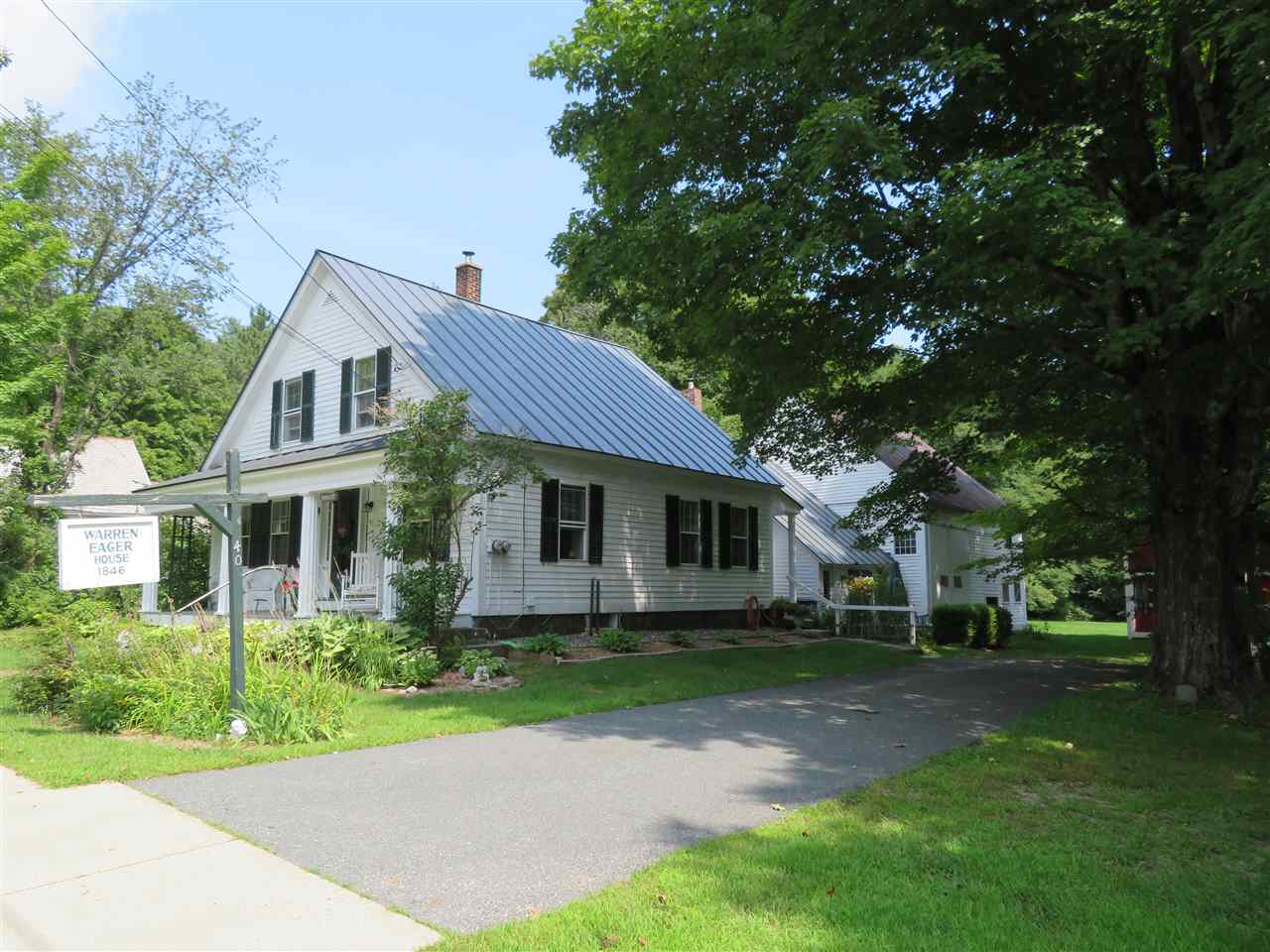 Pretty as a postcard, the Warren Eager House sits...