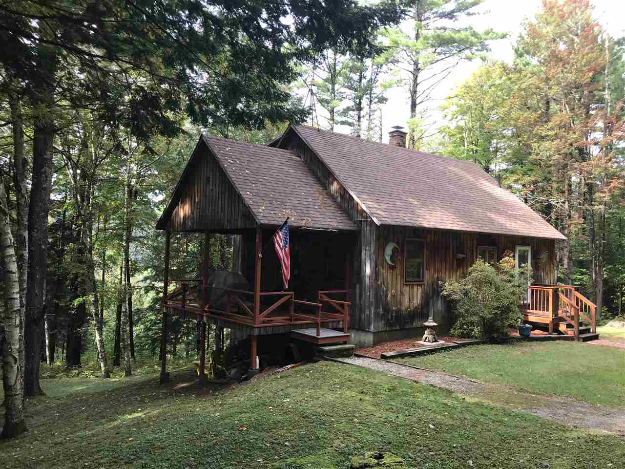 Close to town privacy! This cozy cape sits on...
