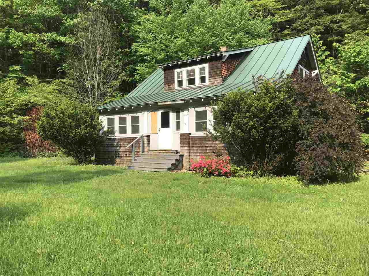 This craftsman style Cape offers wonderful...