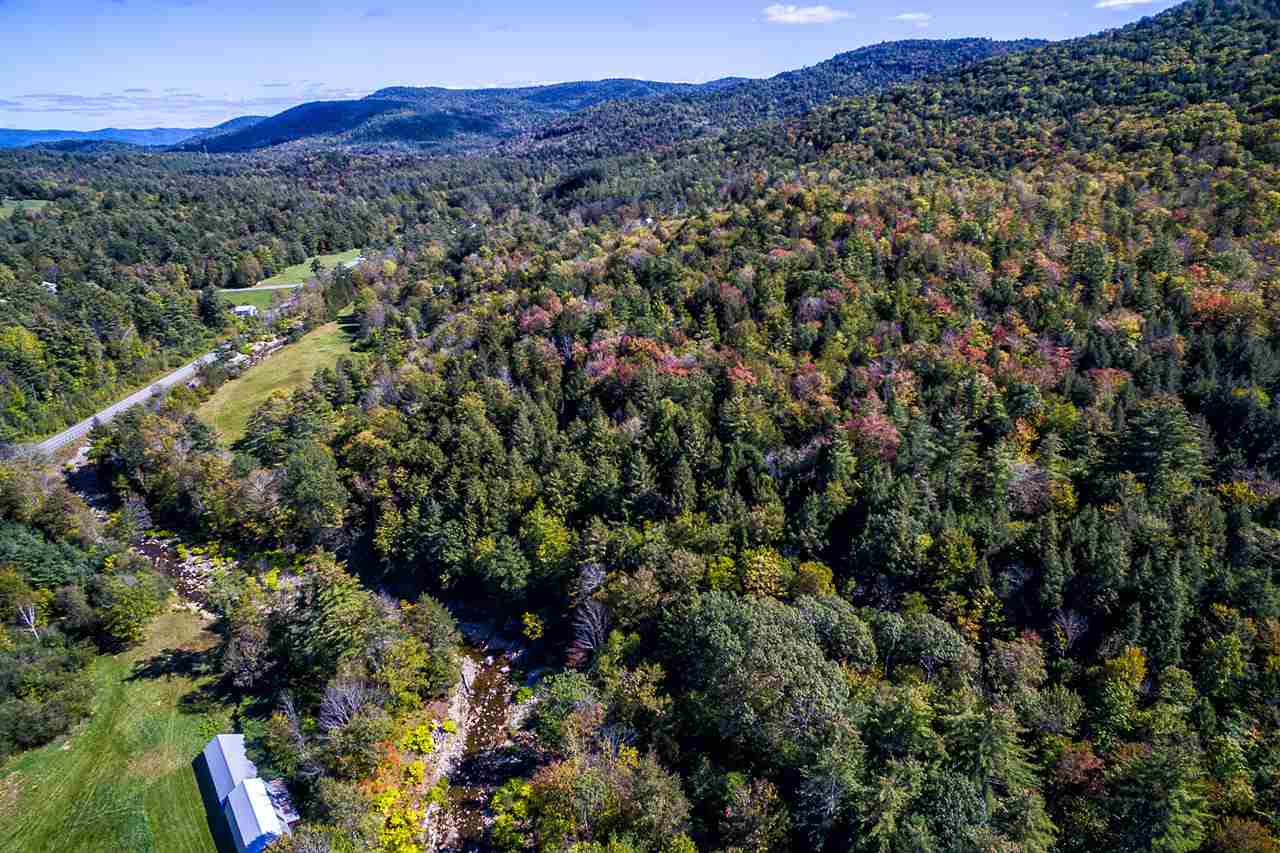 121 acres of mostly wooded and rolling land. A...