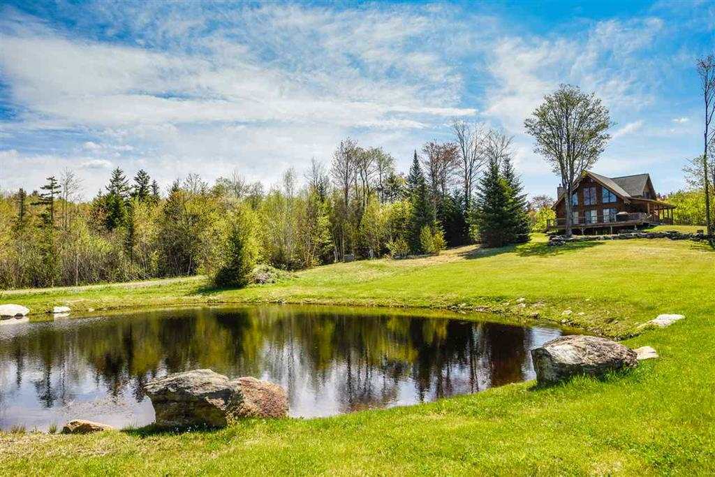 This spectacular 4 bedroom log home sits on 10+...