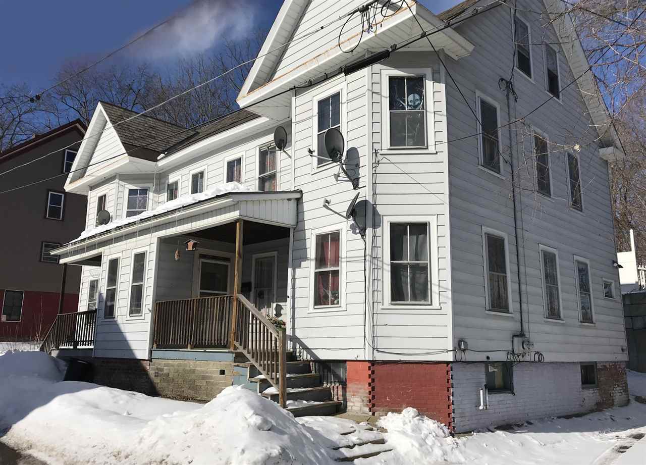 This duplex with identical units each consisting...