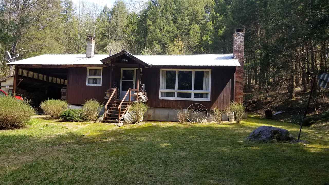 Situated on 9.92 acres of private wooded land...
