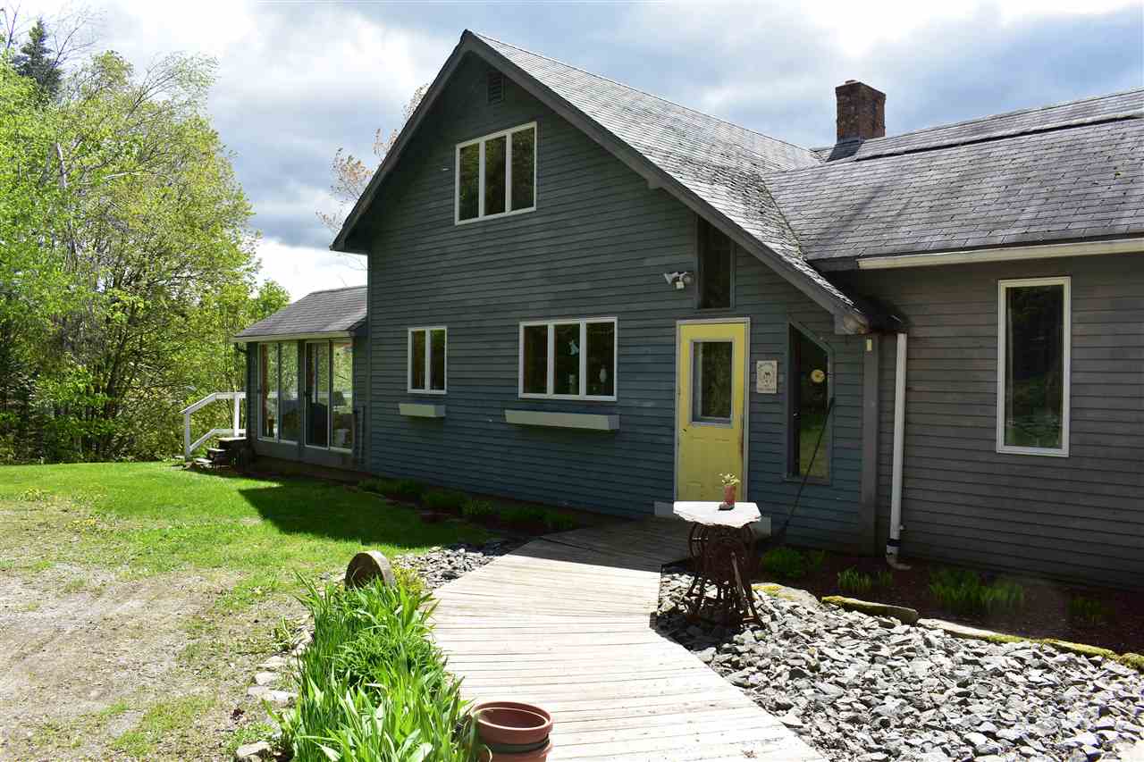 With far-ranging views, this country home...