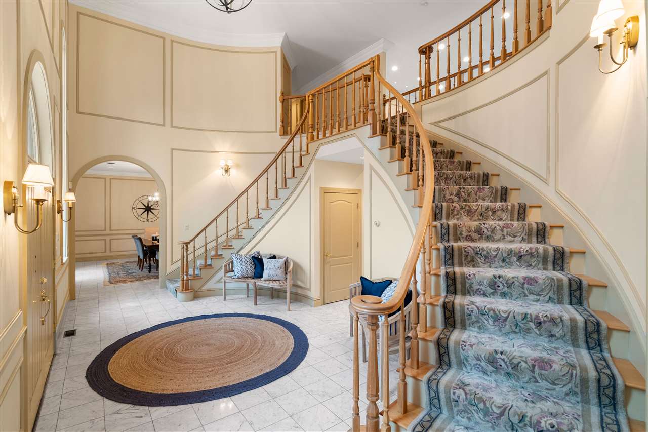 The double curved staircases are elegant! 14837652