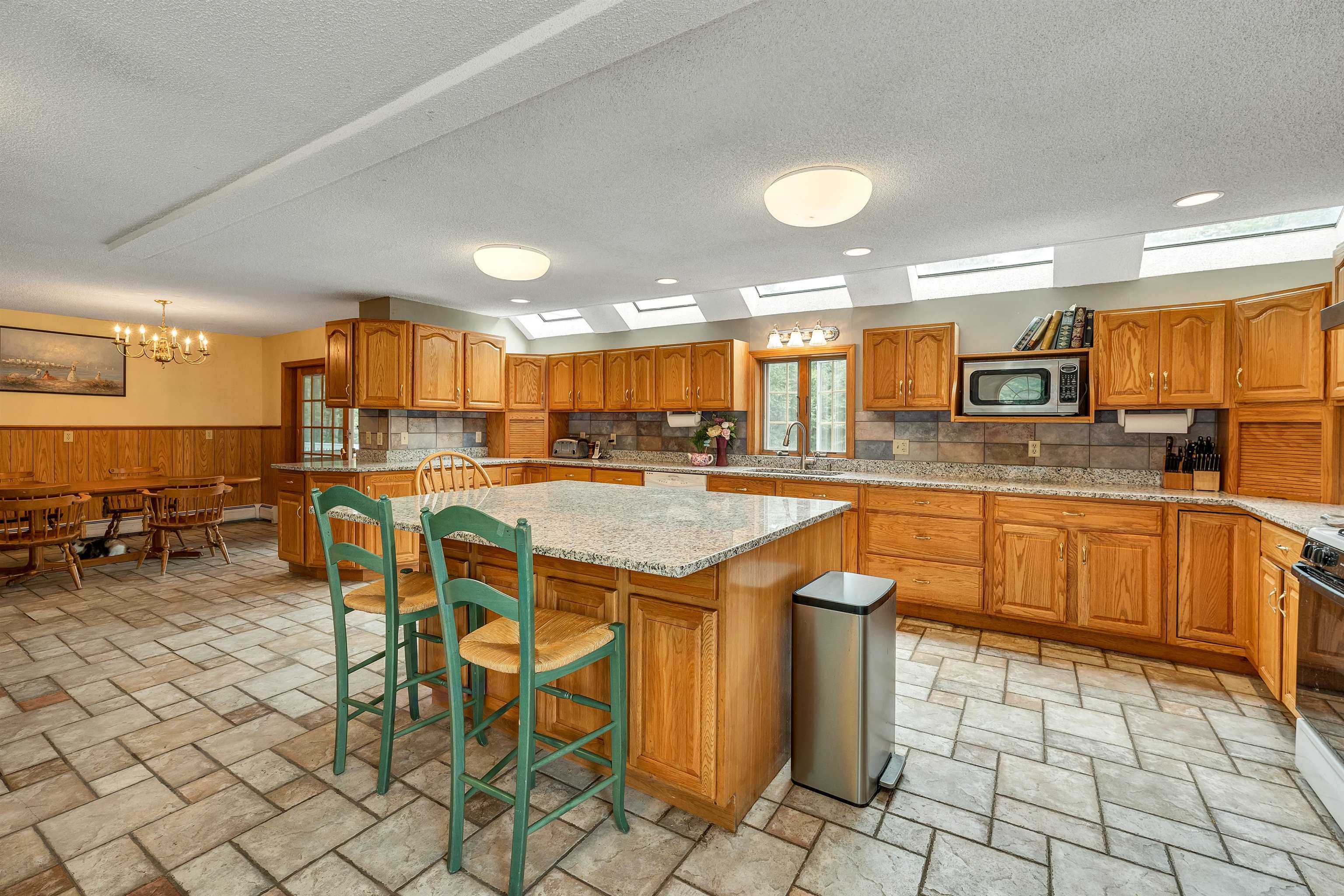 Granite island is also perfect as a serving area as well as a big cooking space.. This kitchen has served party meals for over 100 people.