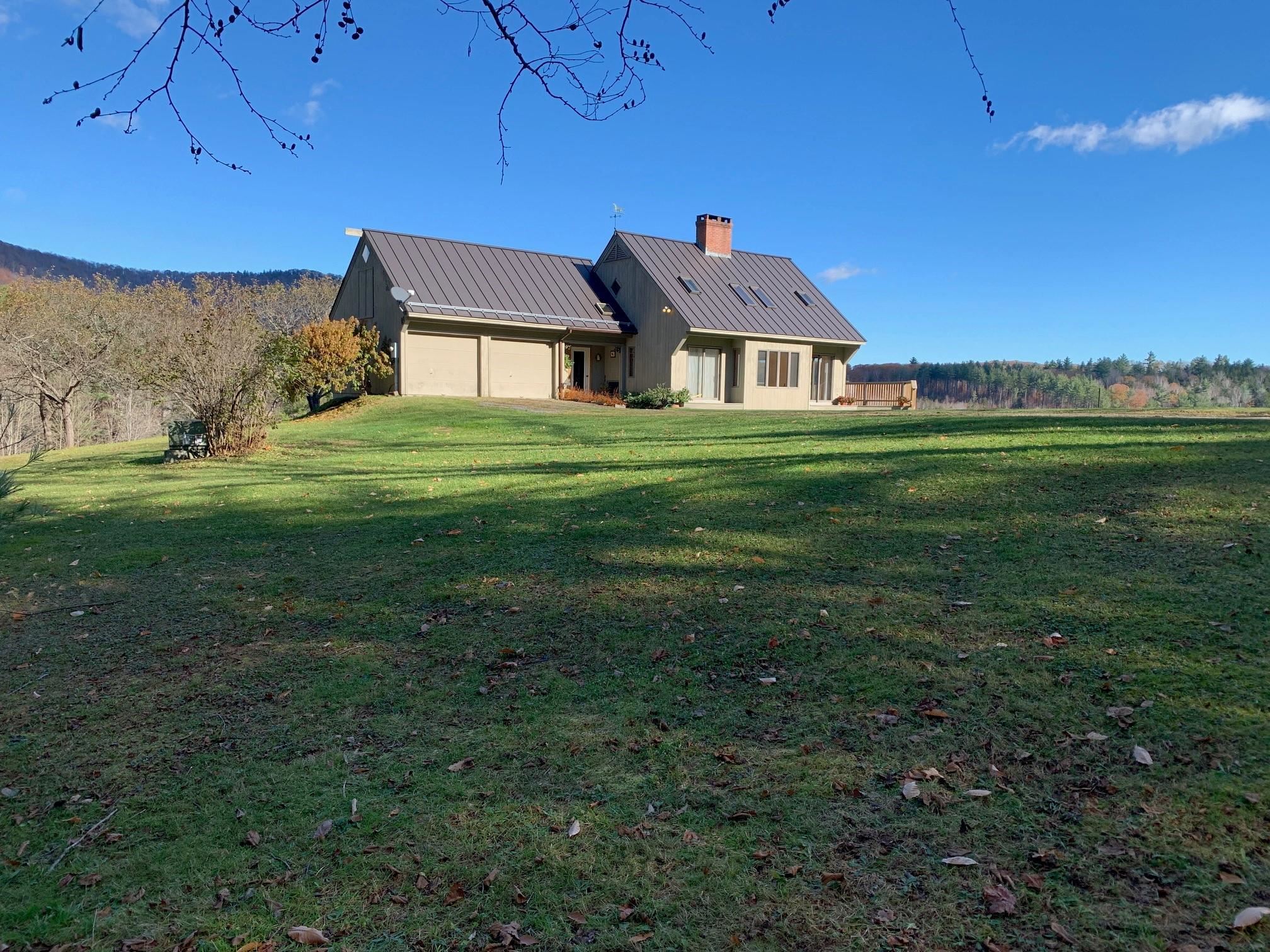 This sun-filled 2-3 bedroom contemporary cape overlooking a spring fed pond sits on 35 acres with stunning views of Mt Ascutney. Open land bordered by stone walls and the north branch of the Black River is perfect for pasture or gardens. The interior is bright with vaulted ceilings in the living area. A kitchen with granite counters, stainless steel appliances and oak flooring opens to a spacious deck. The home is easily maintained with room to expand in the walkout basement or over the 2 car garage. Close proximity to Woodstock, Okemo Mountain and Mt. Ascutney.