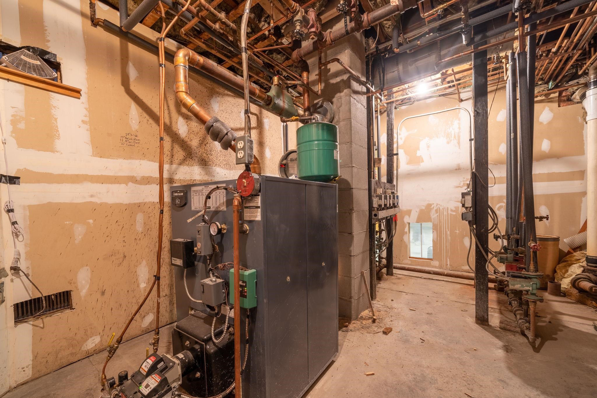 An upgrade to the heating system, including a new boiler and a new masonry chimney, was completed in the fall of 2021! Metering is set up to allow for a future owner to have tenants pay for their own heat.