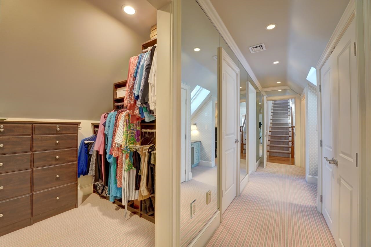 The hallway into the BR with bath, custome closets, etc.