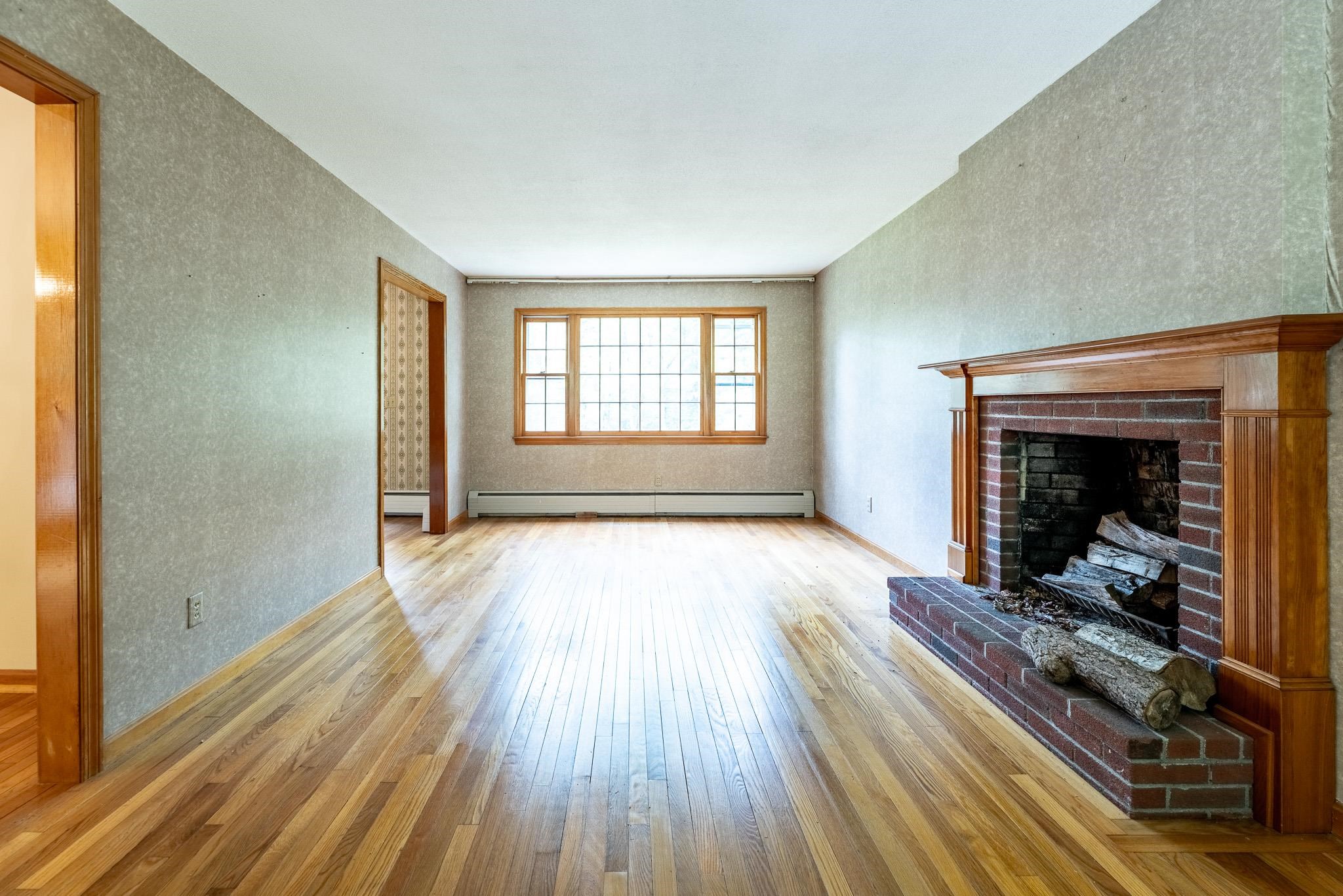 Light, bright living room off formal entryway