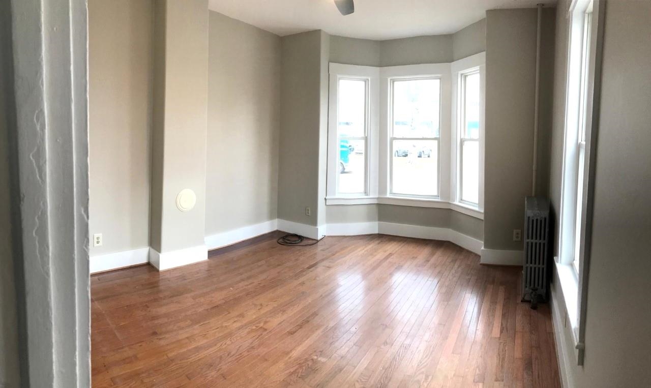 102 Living room with hardwood floors - bay window