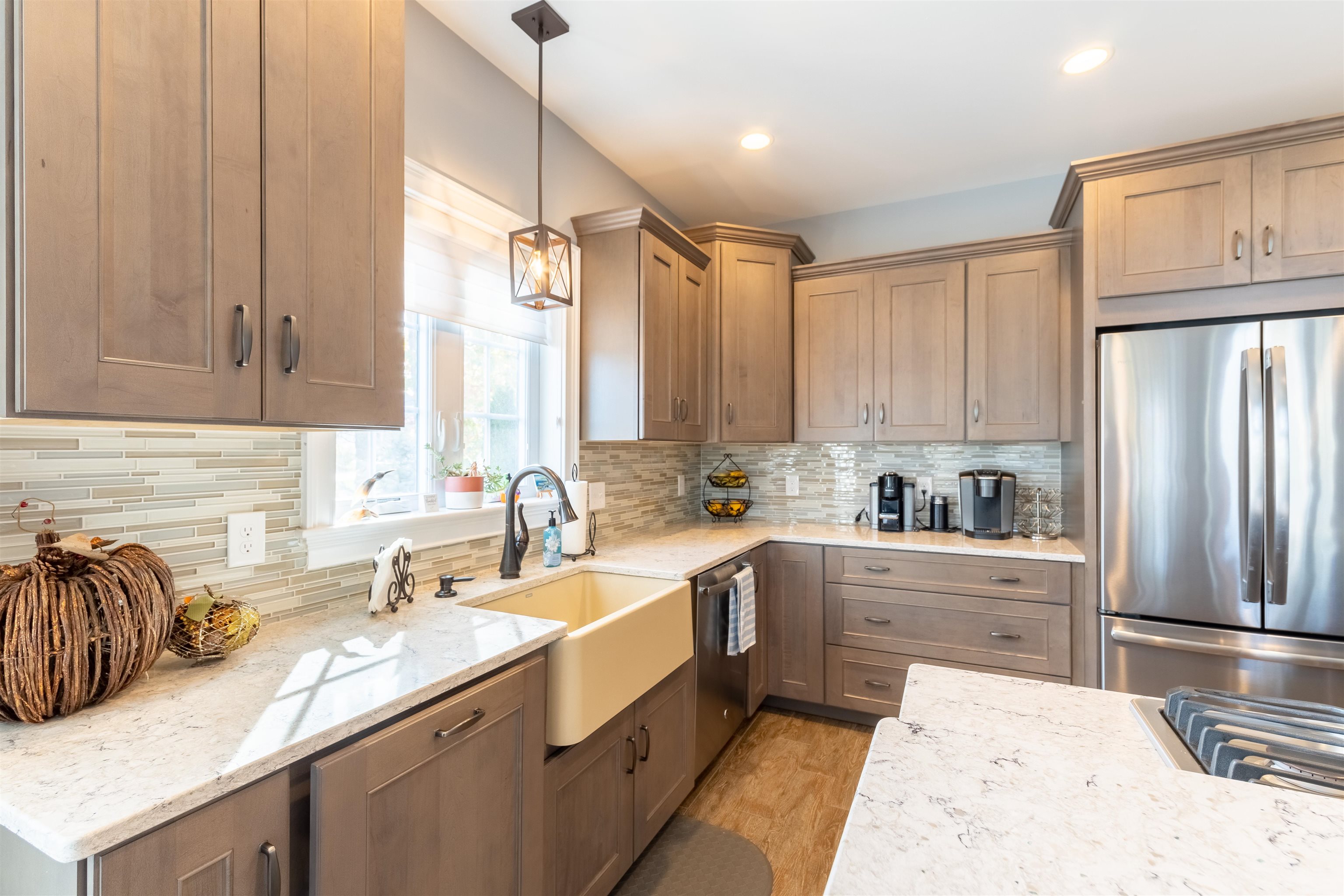 Well appointed kitchen is sure to please the novice to most talent cooks.  Double wall oven, cook top gas range to the stylish farmers sink and Quartz countertops. Come discover this amazing kitchen with adjacent dining area.  The true heart of the home.