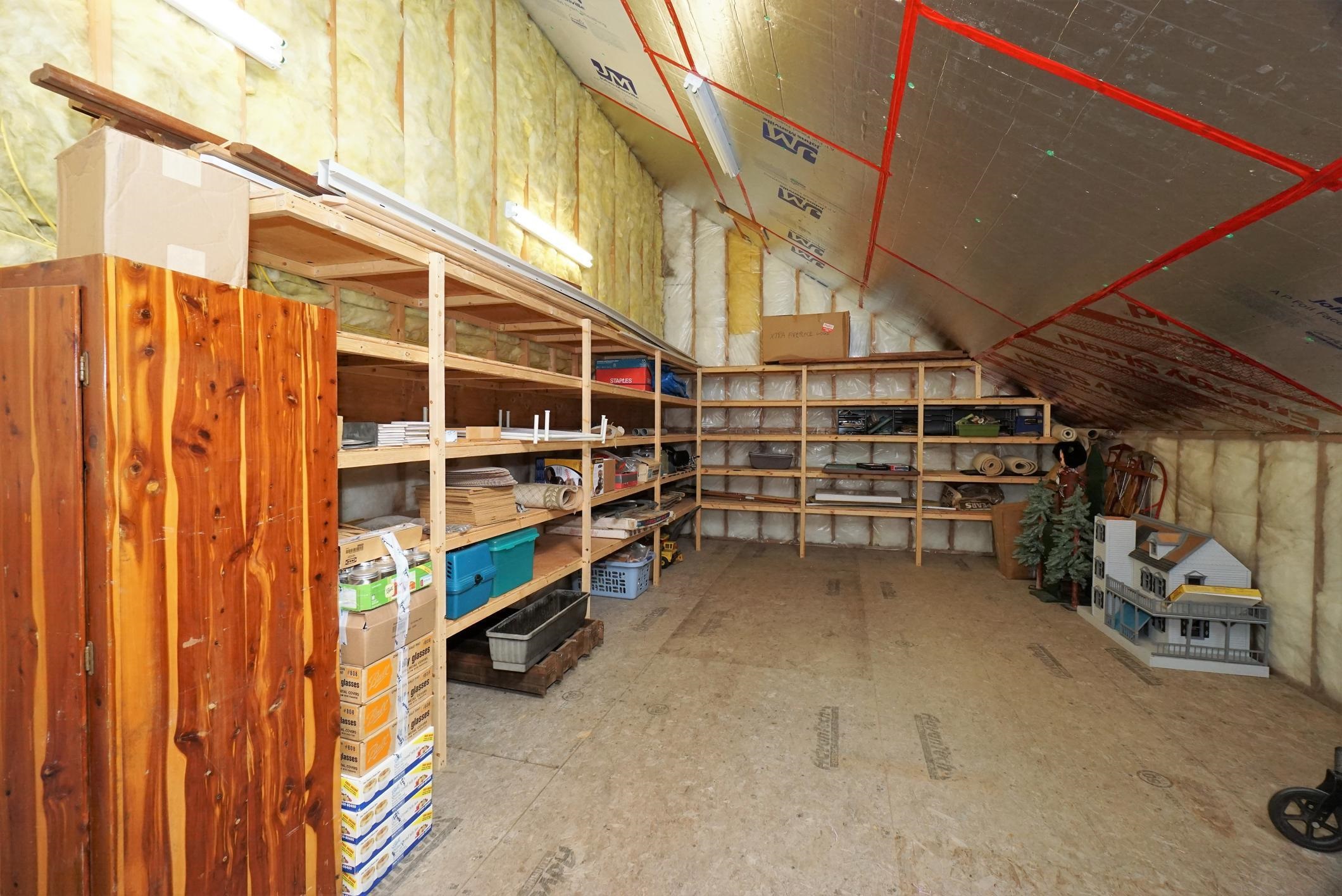 Storage room has access from the 2 bay garage and is located over the single bay garage.