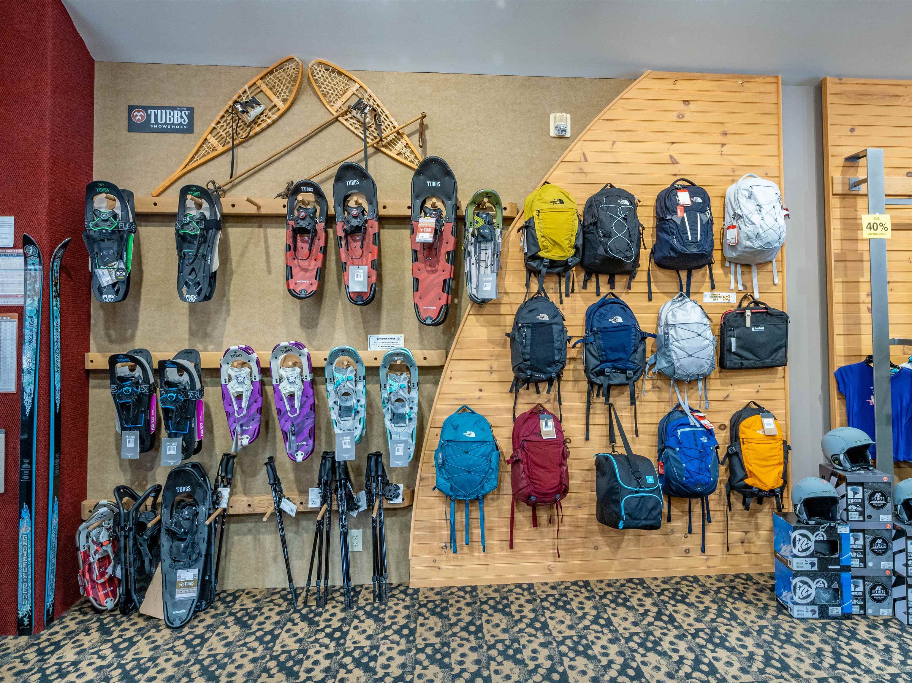 BACKPACK AND SNOWHOES ON WALL DISPLAY