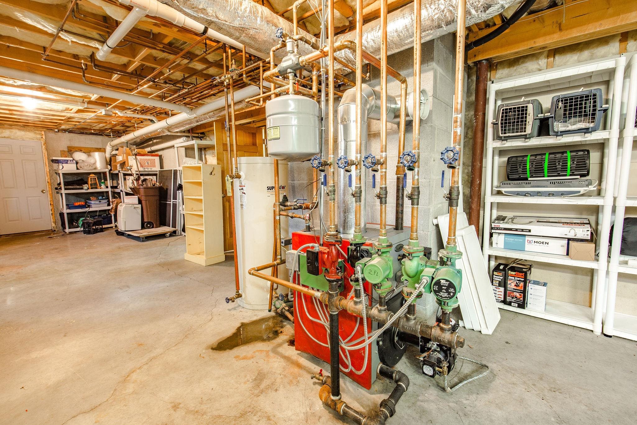 The basement combines a comfortable living space with a very large utility area, with a bulkhead to the back yard.  Another small room housing electricals makes a fine spot to store your wine supply.