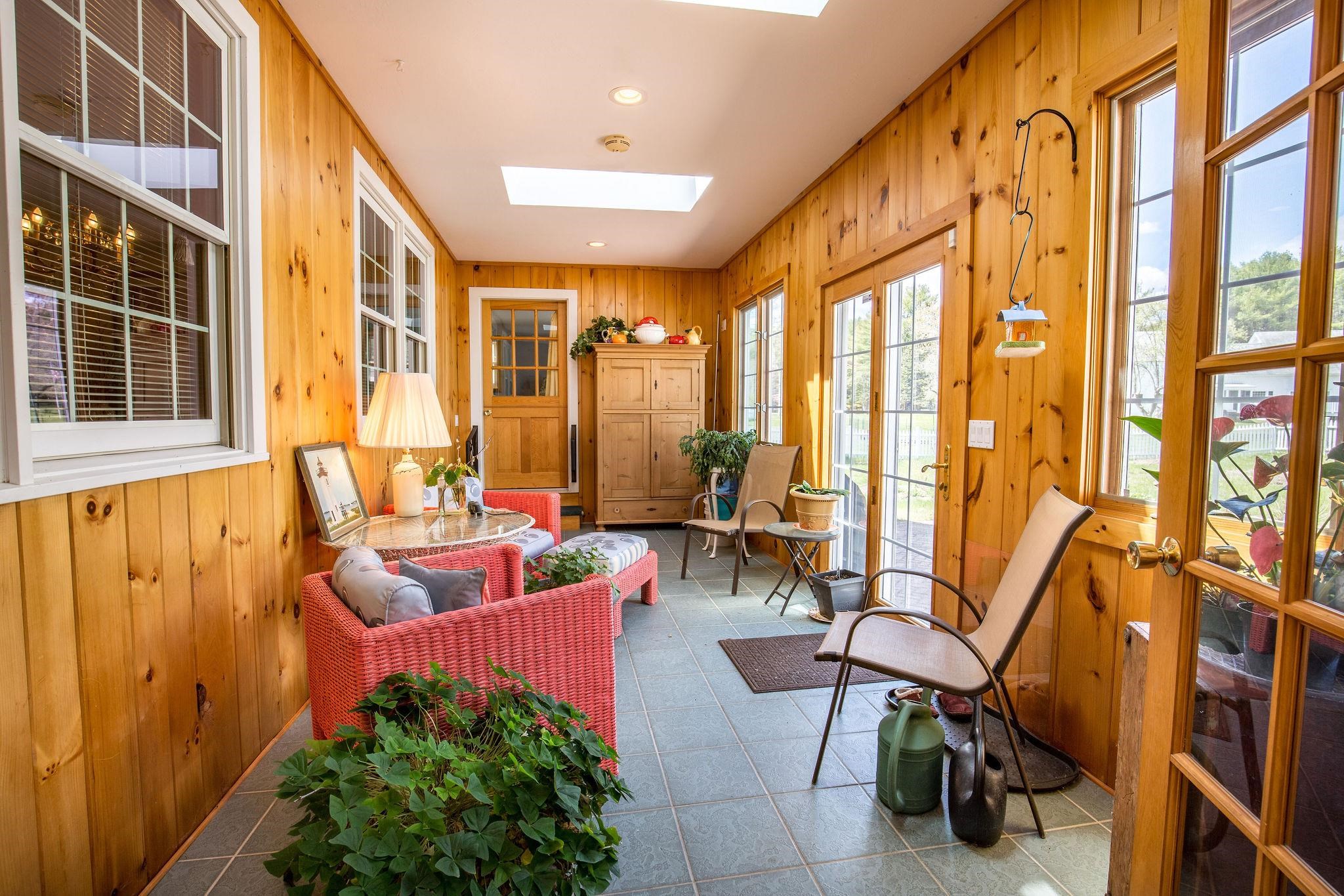 Four season heated porch. Doors lead to outside patio.