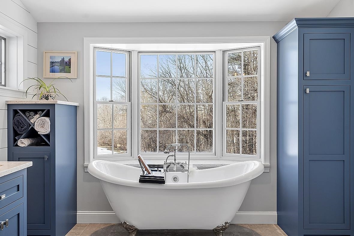 soaking tub with pastoral views of sunsets