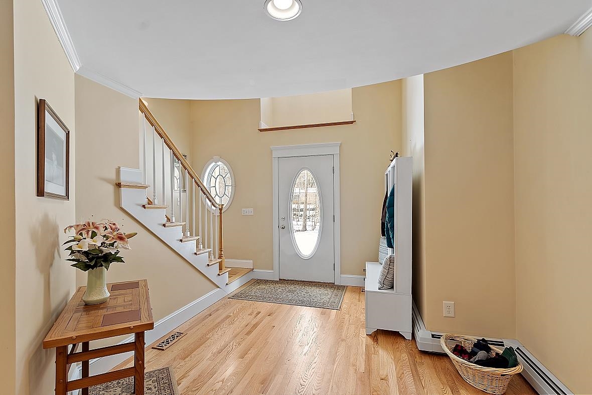 side foyer/mudroom with turning staircase