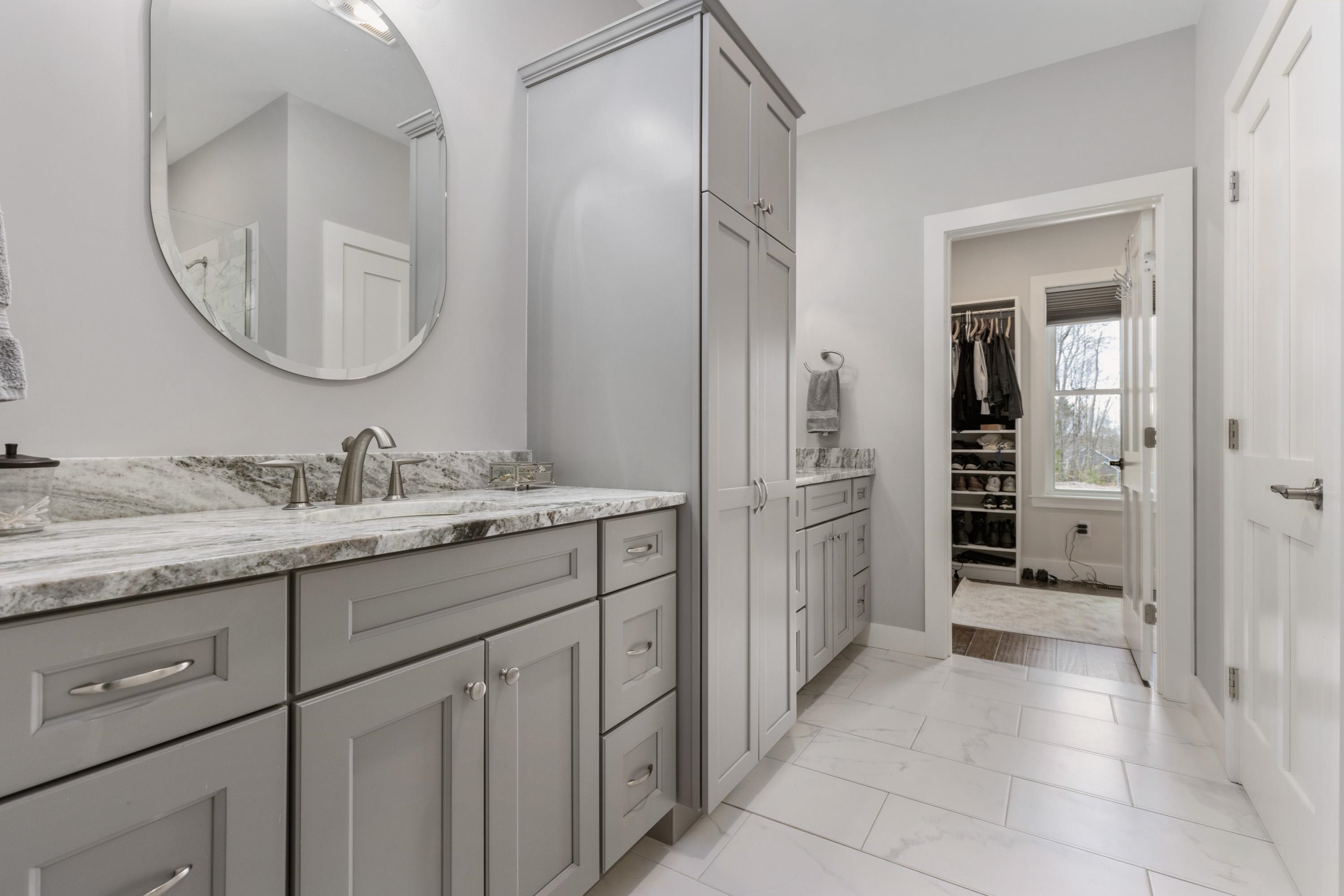 Double vanity sinks, private wash closet, walk-in 2ble head shower