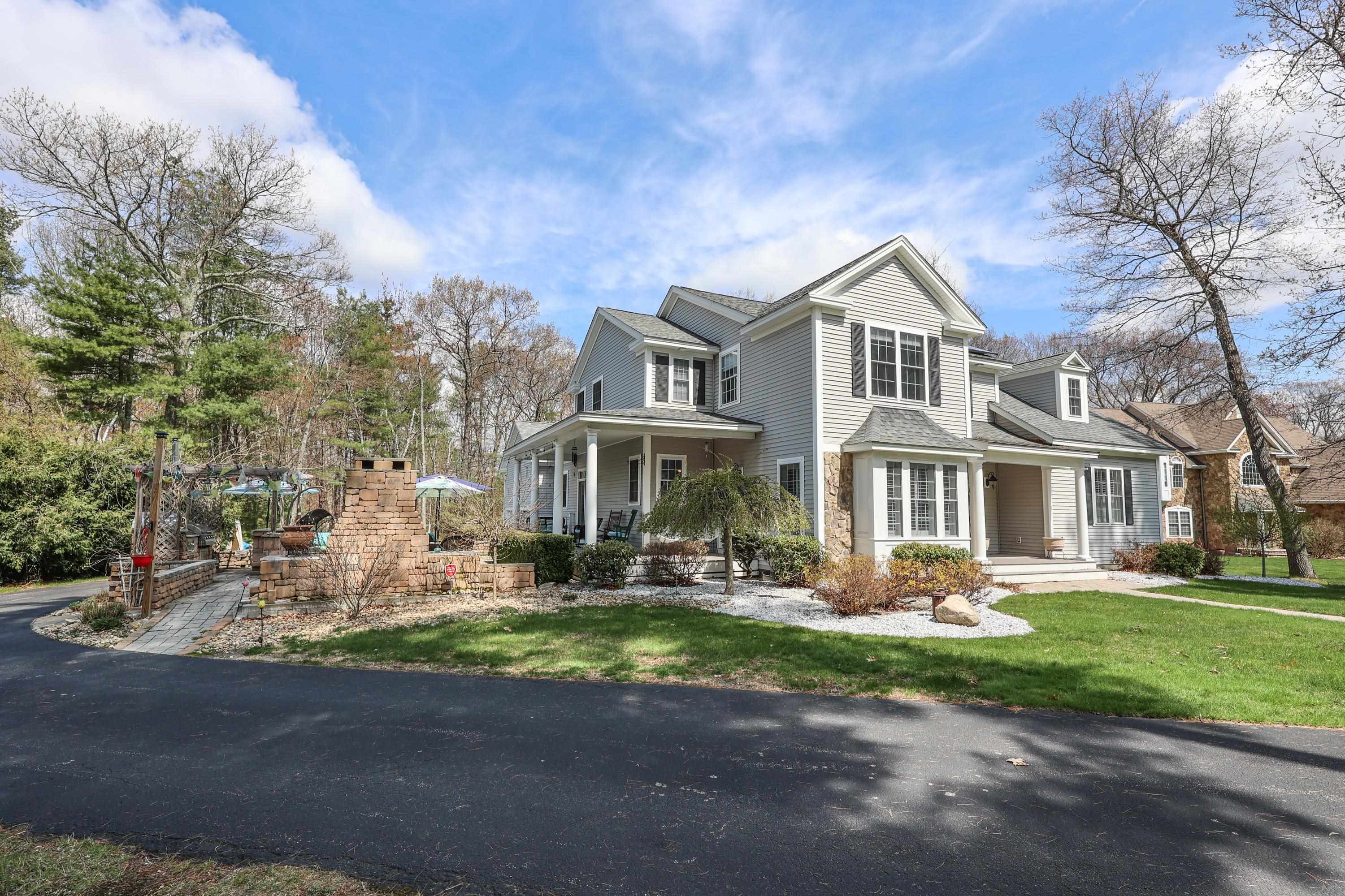 This is the house you’ll want to call home in a quiet and delightful north Londonderry neighborhood. This home is a high-quality Craig Fowler resale with exquisite features, upgrades, and amenities!  Over 3300 sq ft of comfort awaits your arrival.  There are two suites, one on the first floor which includes a fireplace, a hardwood floor, a large walk-in closet, and a primary bath with heated floors (upgraded in 2016). The second-floor suite has a 3/4 bath and was upgraded in 2023.  There are large oversized windows throughout the house. The first level has 9-foot ceilings and Plantation Shutters.  The center Great Room has a gas Fireplace and abuts a large open dining room and kitchen. This huge kitchen/breakfast area has new quality (2021) upgraded wifi-connected appliances (high-tech microwave & glass front refrigerator).  Hardwood floors. Newer carpeting in 2nd-floor bedrooms and family room.  The main bath was upgraded in 2022.  The Sunrun solar panels (2016) have a lower locked-in energy rate.  Open deck off the back.  Front farmer's porch.  The attached 2-car garage has 12' ceilings and additional storage space.  Walk-out daylight basement is begging to be finished.  700 sf brick patio with an outdoor kitchen that includes a propane gas grill, a wood-fired pizza oven, and a fireplace.  Central Vacuum.  Central Air conditioning.  Natural gas heating, water heater, and cooking.  The septic system was replaced in 2013. Showings start Saturday 5/6