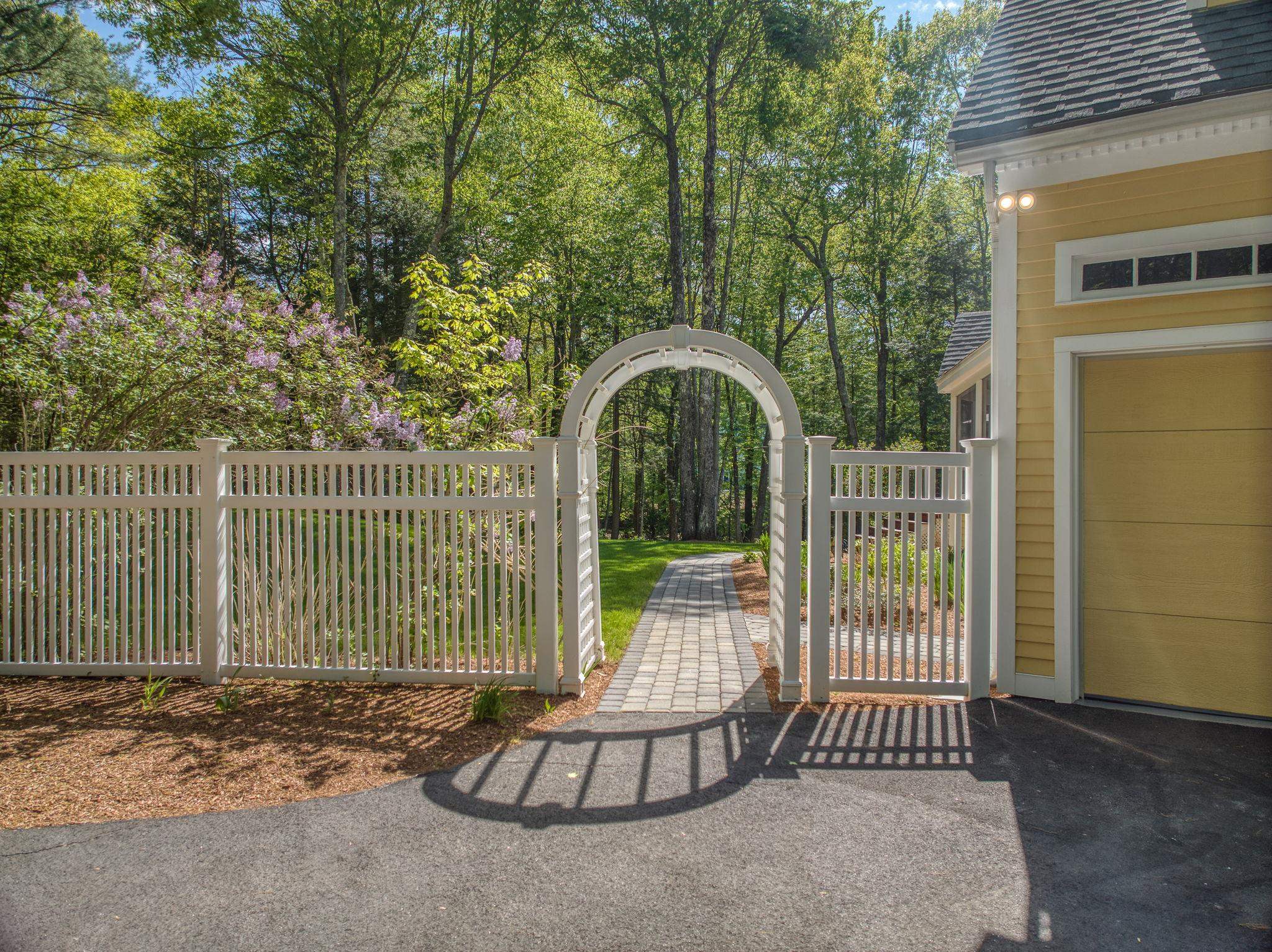 Arched Arbor Draws You to the Backyard