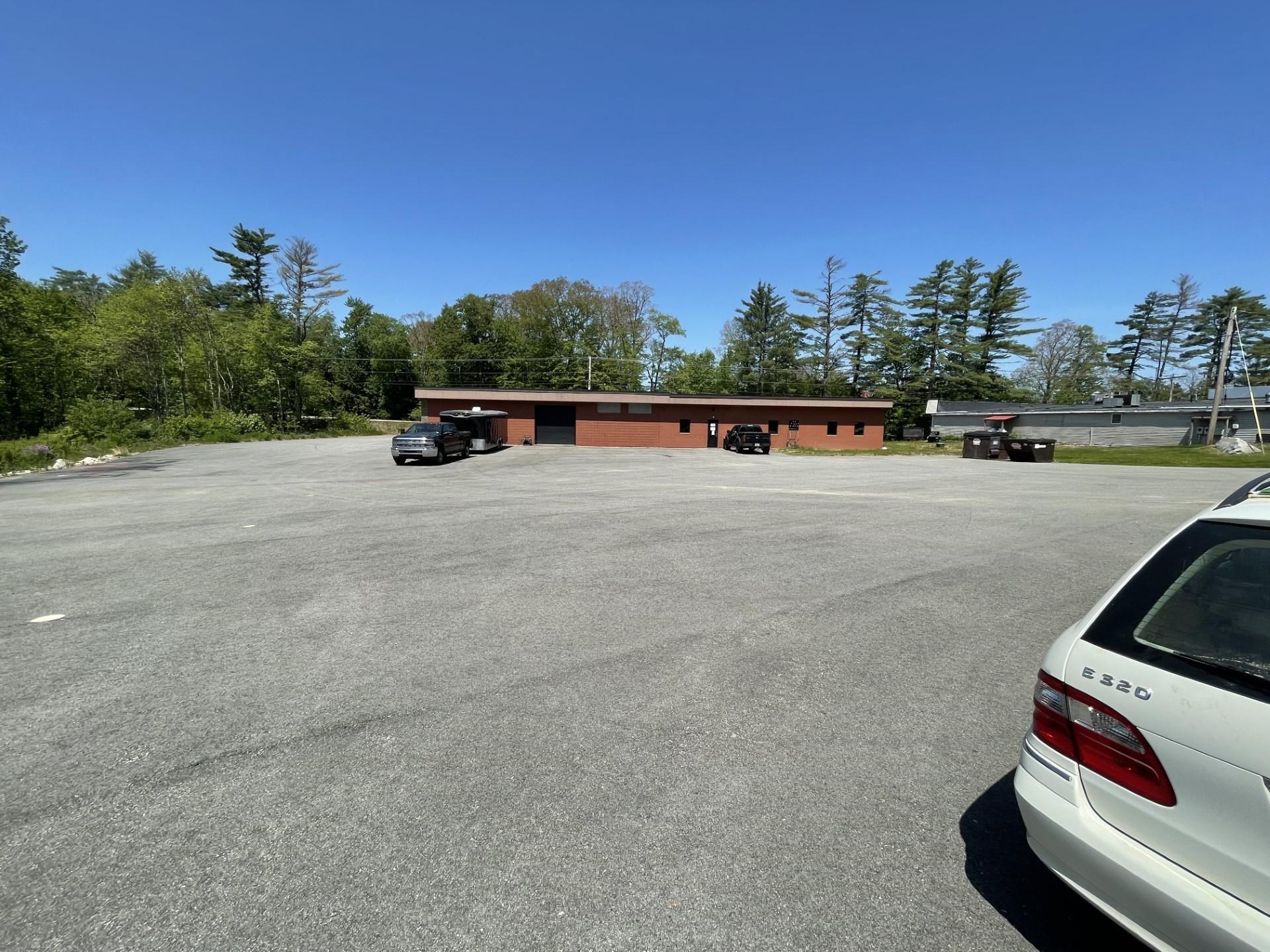 expansive FULLY PAVED parking lot.
