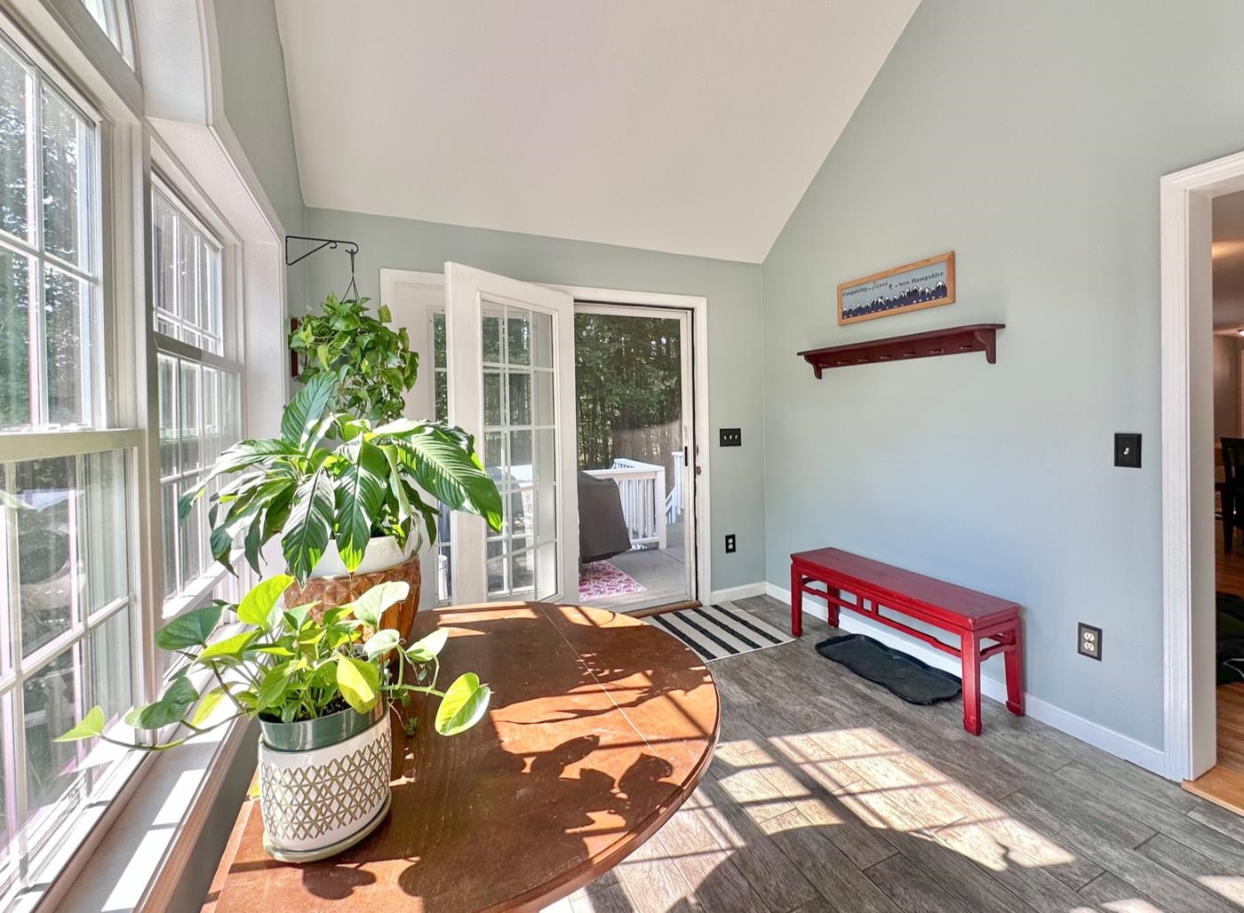Enter the home through the sun-filled porch