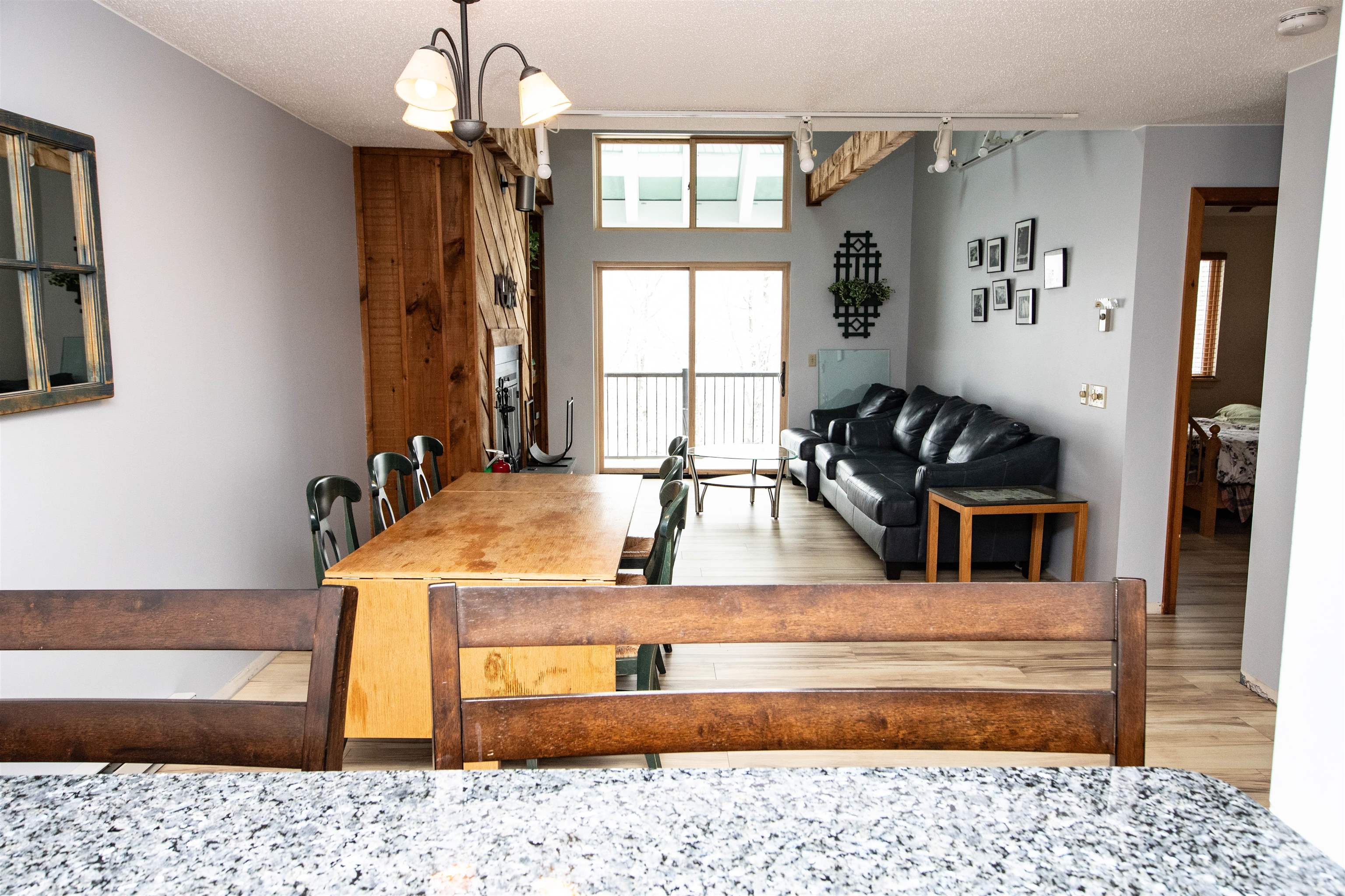 Kitchen, Dining and Living Room with Sliders to Deck 21046919