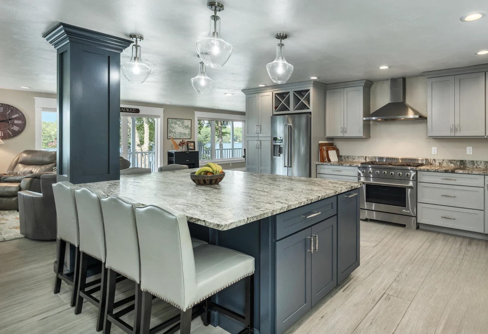 Perfect for entertaining, the main house's layout encourages gatherings, with an oversized leather granite island in the kitchen. New Viking stove