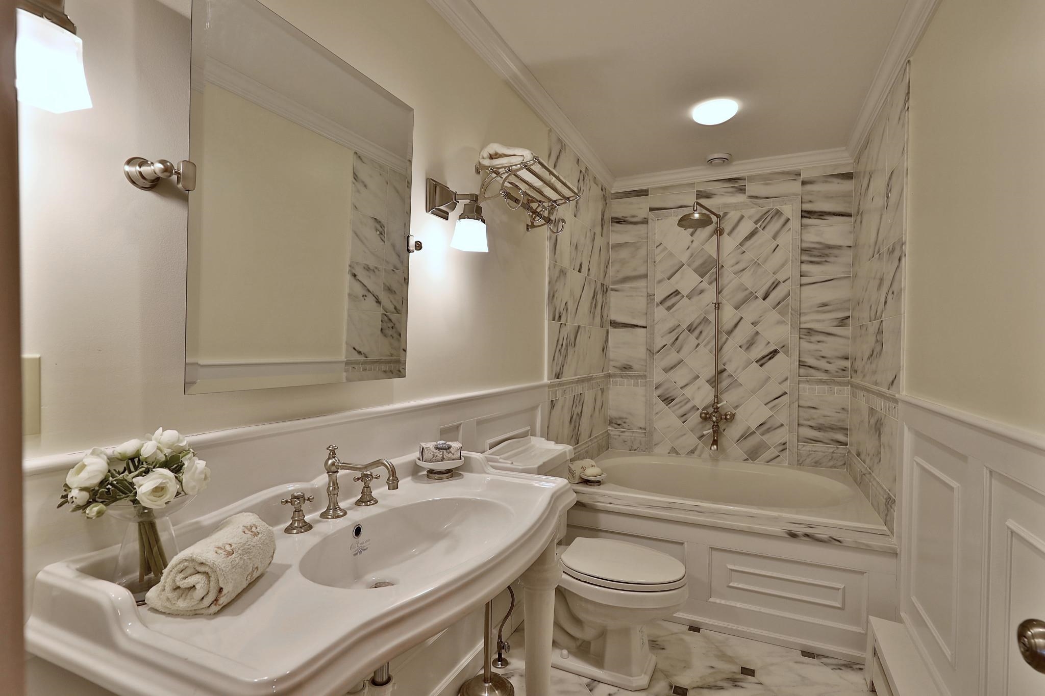 Main floor full bathroom with Vermont Bianco marble bath.