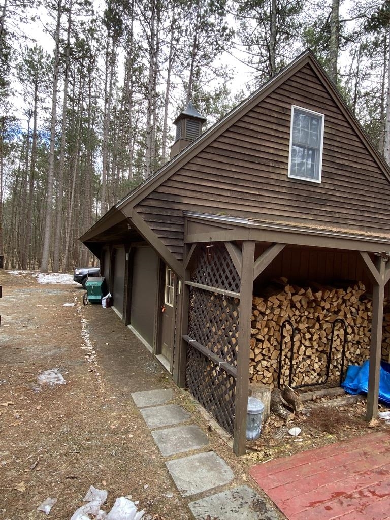 Wood shed end of garage