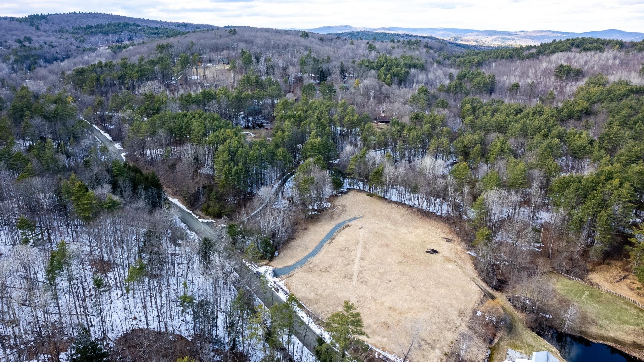 Aerial showing lot, open meadow approx. 40% of property