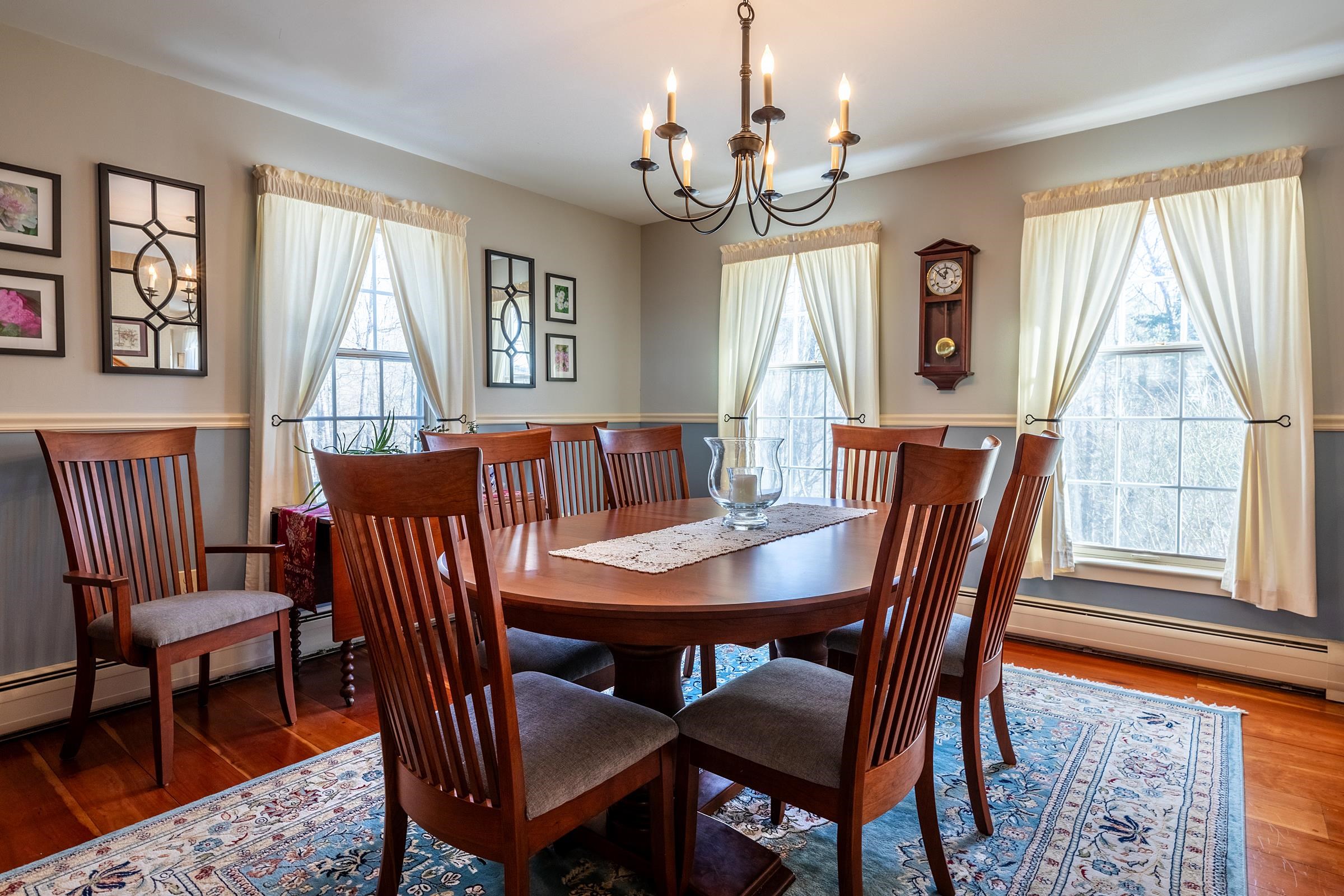 Spacious dining room with cherry wood floors