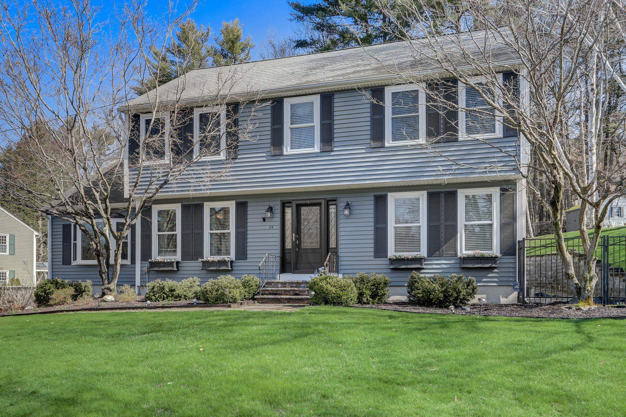 Welcome to 24 Bicentennial Dr., a handsome Colonial home in South Nashua, boasting 3300+ SF, 5 bedrms, 3 baths, a finished LL & 3rd floor, with enclosed screen porch and an in ground heated pool! This home offers all the updates & upgrades you are looking for (Kitchen, Appliances, Bathrooms, Custom Built Ins, Flooring, Paint, Windows & Shades, Slider & Garage Doors, Exterior Siding, Elec Service, EV Charging Station, etc.), in addition to its outstanding location in the desirable Bicentennial School District, within just a few minutes to Rte 3, Exits 1 & 4!  The upgraded, gourmet eat in kitchen offers ample cabinetry and pantry storage along with an oversized island, great lighting and access to the spacious screened porch & pool.  Additionally, off the kitchen is an upgraded ½ bath with private laundry room, front 2 back family room with gas fireplace and an elegant formal dining room! All the flooring throughout the home is hardwood except the 3rd floor and Primary bedroom, which has newly installed neutral carpeting. Both of the bedrooms on the 3rd floor have bright sunny skylights! The property is professionally landscaped with 3 sets of granite steps, retaining walls w/gardens, irrigation and includes a lovely fence surrounding the entire rear yard and pool area with a wooded area behind, providing summer privacy! Come visit our open houses on 4/20 1-4pm and 4/21, 11am-2pm, when showings begin.